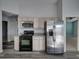 Updated kitchen with stainless steel appliances and light wood cabinets at 742 Sonja Cir, Davenport, FL 33897