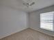 Bright bedroom with tile flooring, ceiling fan, and window with blinds at 742 Sonja Cir, Davenport, FL 33897