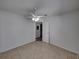 Well-lit bedroom with tile floors and access to another room at 742 Sonja Cir, Davenport, FL 33897