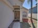Close up of the front door and walkway leading to the house at 742 Sonja Cir, Davenport, FL 33897