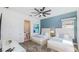 Guest bedroom with two twin beds and en-suite bathroom at 1005 Coyote Creek Way, Reunion, FL 34747