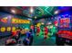Fun game room with arcade games and seating at 1005 Coyote Creek Way, Reunion, FL 34747