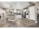 Modern kitchen with white cabinets, stainless steel appliances, and an island at 4510 Roundup Dr, Polk City, FL 33868