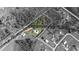 Aerial view of a house on a large lot with surrounding trees and pond at 4510 Roundup Dr, Polk City, FL 33868