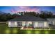 Newly constructed home with attached garage, manicured lawn and landscaping at 4510 Roundup Dr, Polk City, FL 33868