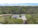 House on a large lot with attached garage and lush surroundings at 4510 Roundup Dr, Polk City, FL 33868