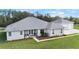Single-story house with attached garage and expansive lawn at 4510 Roundup Dr, Polk City, FL 33868