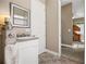 Bathroom with vanity, granite countertop and view of bedroom at 4510 Roundup Dr, Polk City, FL 33868