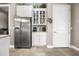 Kitchen features stainless steel refrigerator and coffee bar at 4510 Roundup Dr, Polk City, FL 33868