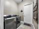 Laundry room with side-by-side washer and dryer, and access to exterior at 4510 Roundup Dr, Polk City, FL 33868