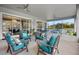 Spacious screened porch with multiple seating areas and views at 4510 Roundup Dr, Polk City, FL 33868