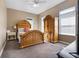 Spacious bedroom with wood furniture and large windows at 4510 Roundup Dr, Polk City, FL 33868