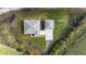 Bird's-eye view of house and garage on a large lot at 4510 Roundup Dr, Polk City, FL 33868