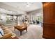 Open living room with views of the kitchen and access to the backyard patio at 4510 Roundup Dr, Polk City, FL 33868
