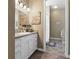 Elegant bathroom with white cabinets and granite countertop at 4510 Roundup Dr, Polk City, FL 33868
