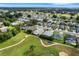 Aerial view showcasing the community's location and golf course at 6250 Sandpipers Dr, Lakeland, FL 33809