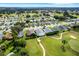 Aerial view of a single-Gathering home near a golf course at 6250 Sandpipers Dr, Lakeland, FL 33809