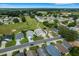 Aerial view of a house and surrounding area, near a golf course at 6250 Sandpipers Dr, Lakeland, FL 33809