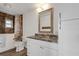 Bathroom with walk-in shower, granite countertop, and linen closet at 6250 Sandpipers Dr, Lakeland, FL 33809