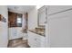 Bathroom with walk-in tub, granite countertop, and updated vanity at 6250 Sandpipers Dr, Lakeland, FL 33809