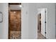 Spa-like bathroom with walk-in shower, pebble floor, and linen closet at 6250 Sandpipers Dr, Lakeland, FL 33809