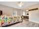 Bedroom with floral bedding, mirrored closet, and ceiling fan at 6250 Sandpipers Dr, Lakeland, FL 33809