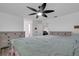 Main bedroom features king bed, ceiling fan, and two dressers at 6250 Sandpipers Dr, Lakeland, FL 33809
