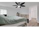 Spacious bedroom with king-size bed and ceiling fan at 6250 Sandpipers Dr, Lakeland, FL 33809