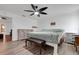 Main bedroom with king bed, two dressers, and ceiling fan at 6250 Sandpipers Dr, Lakeland, FL 33809