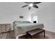 Main bedroom with king-size bed, dresser, and ceiling fan at 6250 Sandpipers Dr, Lakeland, FL 33809