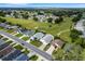 Aerial view of a community with golf course and houses at 6250 Sandpipers Dr, Lakeland, FL 33809