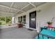 Covered patio with seating area and screened enclosure at 6250 Sandpipers Dr, Lakeland, FL 33809