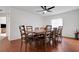 Dining room features hardwood floors, large table, and six chairs at 6250 Sandpipers Dr, Lakeland, FL 33809