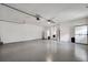 Spacious garage with epoxy floor and ceiling fan at 6250 Sandpipers Dr, Lakeland, FL 33809