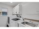 Laundry room with washer, dryer, and utility sink at 6250 Sandpipers Dr, Lakeland, FL 33809