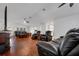 Spacious living room with hardwood floors and comfortable leather recliners at 6250 Sandpipers Dr, Lakeland, FL 33809