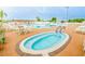 Relaxing community pool and spa with lounge chairs at 6250 Sandpipers Dr, Lakeland, FL 33809