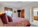 Spacious bedroom with a king-size bed and en-suite bathroom at 6256 Sandpipers Dr, Lakeland, FL 33809