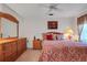 Bedroom with a queen-size bed and dresser at 6256 Sandpipers Dr, Lakeland, FL 33809