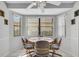 Cozy dining area with a round table and four chairs at 6256 Sandpipers Dr, Lakeland, FL 33809