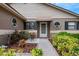 Welcoming front entrance with landscaping and a paved walkway at 6256 Sandpipers Dr, Lakeland, FL 33809