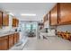 Kitchen features wood cabinets, white appliances, and an eat-in area at 6256 Sandpipers Dr, Lakeland, FL 33809