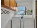 Laundry room with washer, dryer, and cabinets at 6256 Sandpipers Dr, Lakeland, FL 33809