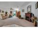 Open living room featuring a fireplace and ample natural light at 6256 Sandpipers Dr, Lakeland, FL 33809