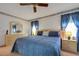 Main bedroom includes a king-size bed, double vanity and lots of light at 6256 Sandpipers Dr, Lakeland, FL 33809
