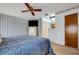 King-size bed, ensuite access and ceiling fan in spacious main bedroom at 6256 Sandpipers Dr, Lakeland, FL 33809