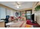 Relaxing sunroom boasts wicker furniture and access to the backyard at 6256 Sandpipers Dr, Lakeland, FL 33809