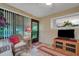 Comfortable sunroom includes wicker seating and a view of the backyard at 6256 Sandpipers Dr, Lakeland, FL 33809