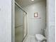 Clean bathroom with a shower and toilet at 6461 Hollyberry Ne Ln, Winter Haven, FL 33881
