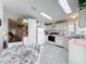 Clean and bright kitchen featuring white appliances and ample cabinet space at 6461 Hollyberry Ne Ln, Winter Haven, FL 33881